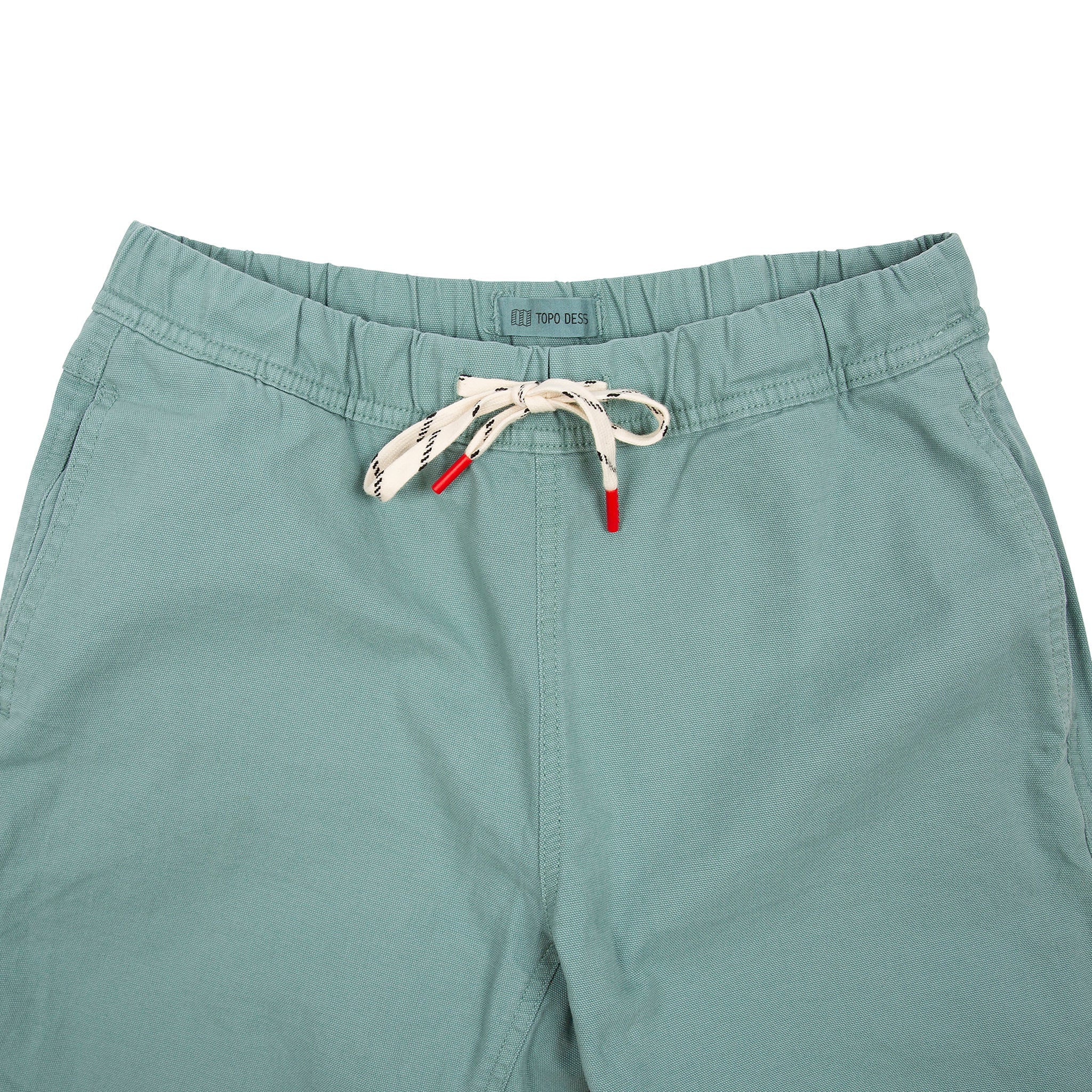 General front detail shot of Topo Designs Women's Dirt Pants in Sage green showing drawstring waist.