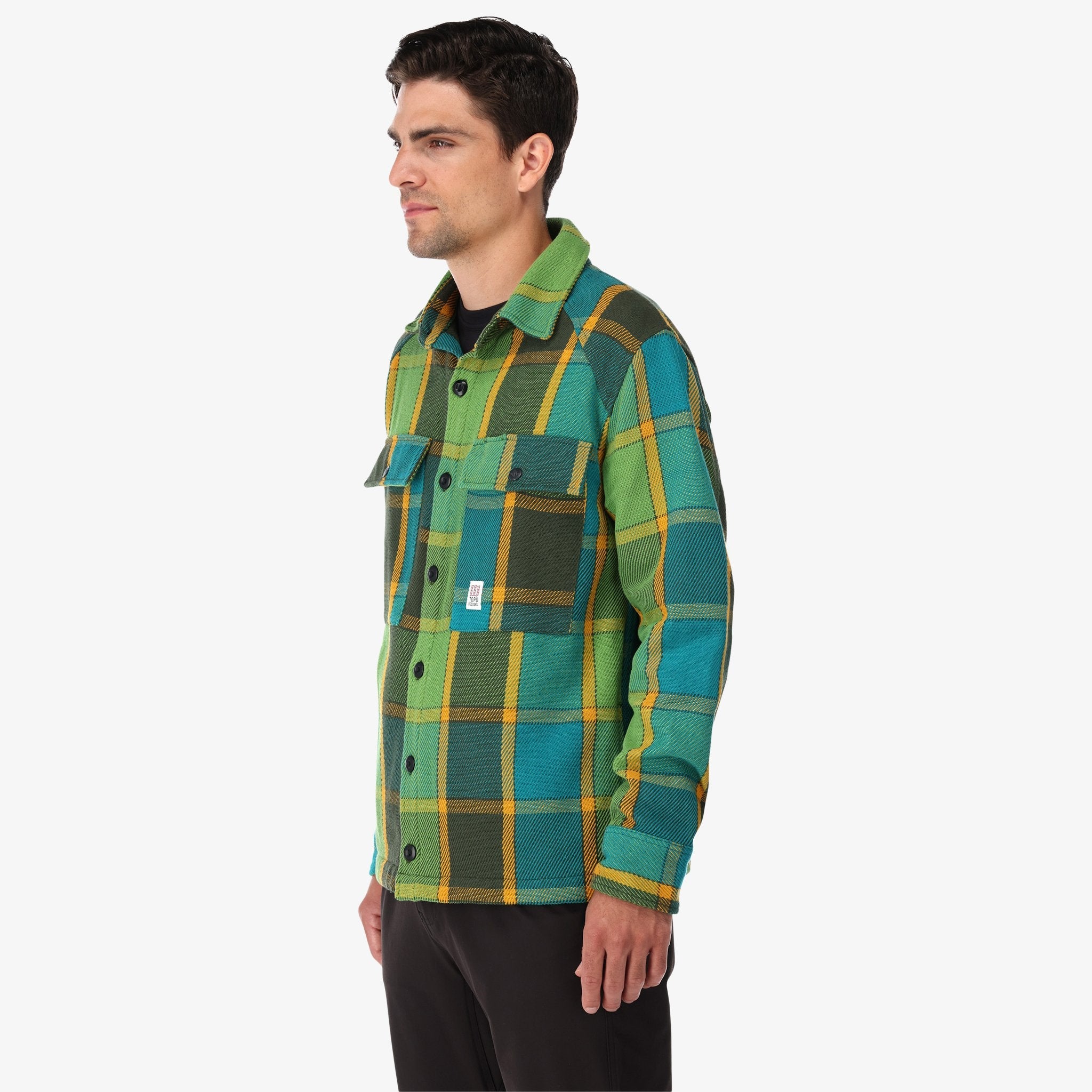 Topo Designs Men's Mountain Shirt Jacket in Olive green gold plaid on model.