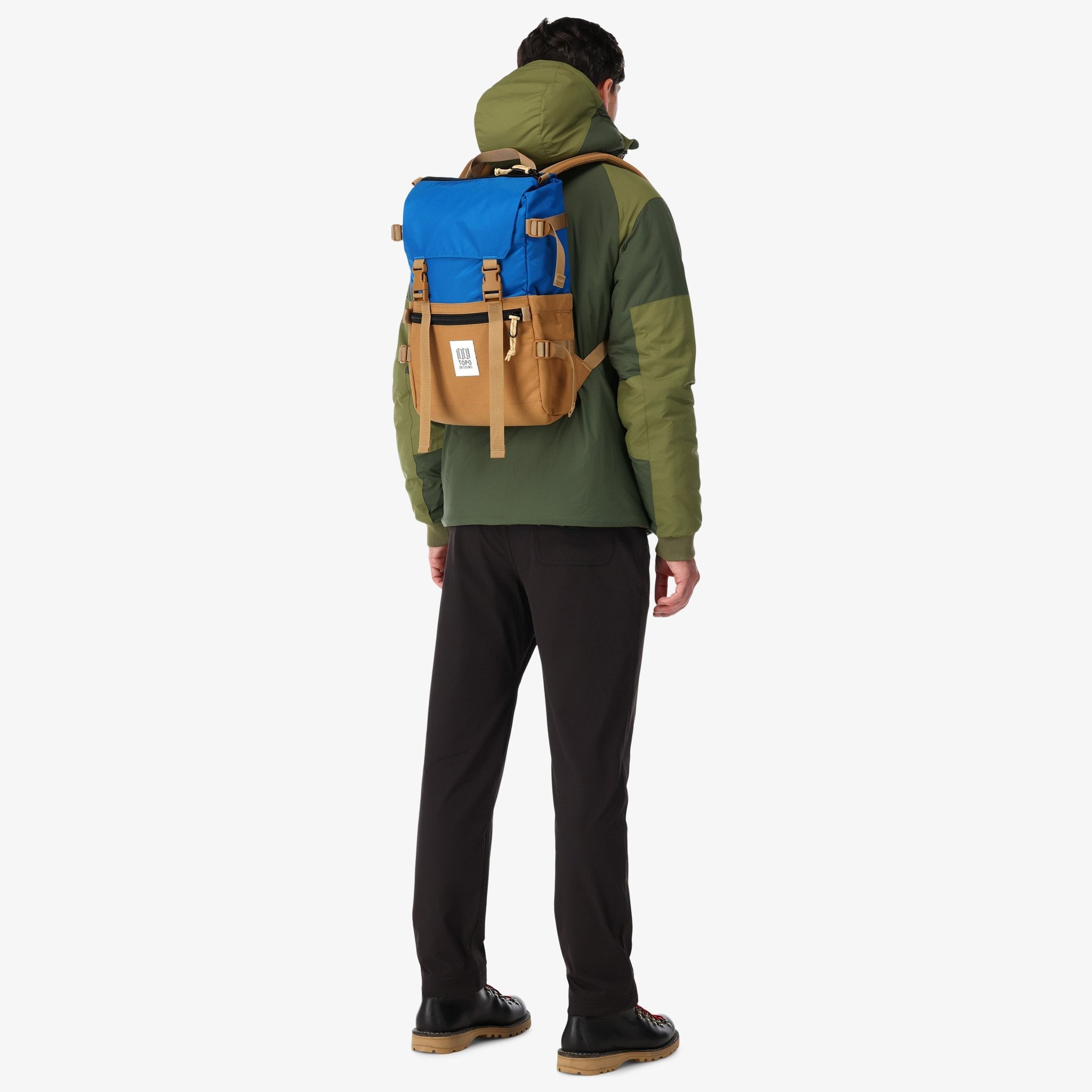 Topo Designs Rover Pack Classic laptop backpack in 100% recycled "blue / khaki" nylon on model's back.