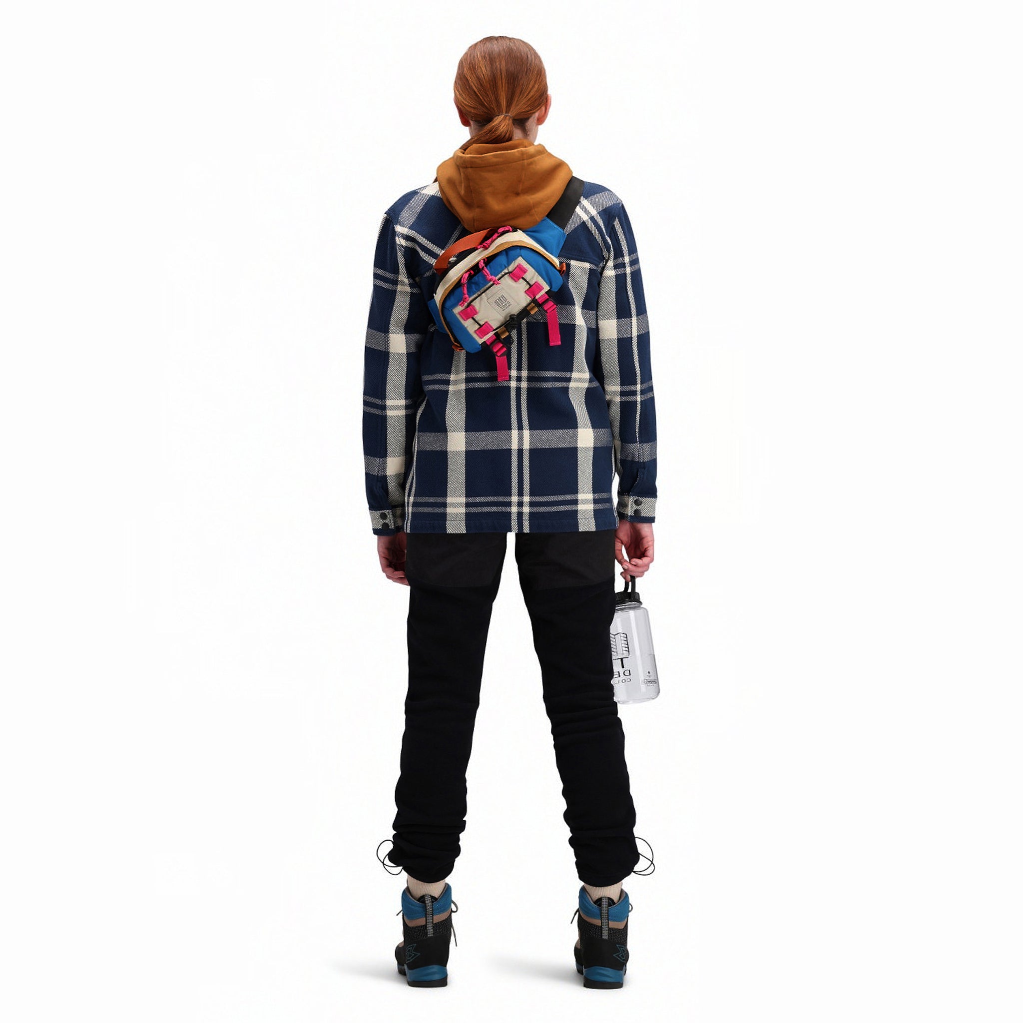 Back model shot of Topo Designs Women's Mountain Shirt Jacket in "navy / white plaid"