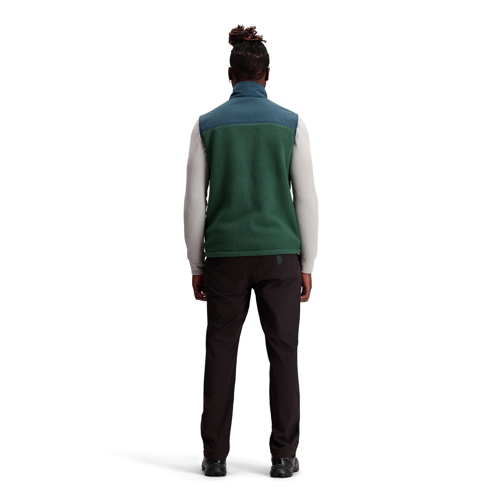 General shot of Subalpine fleece vest in "Forest / Pond Blue"