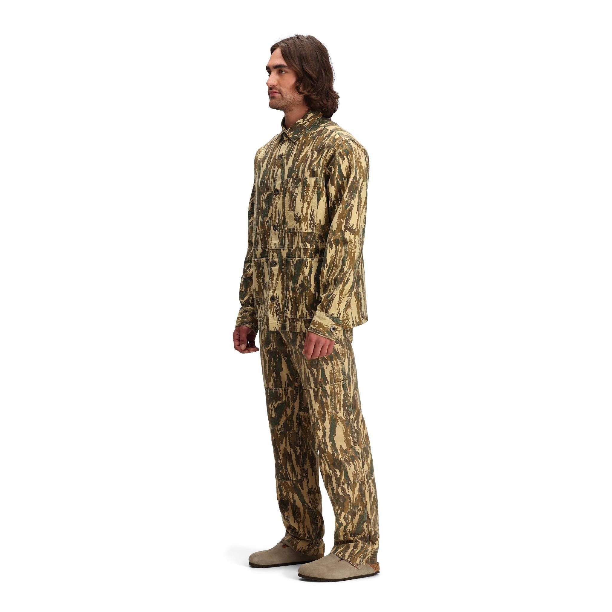 General side model shot of Topo Designs Dirt Utility Jacket - Men's  in "Dirt Camo Print"