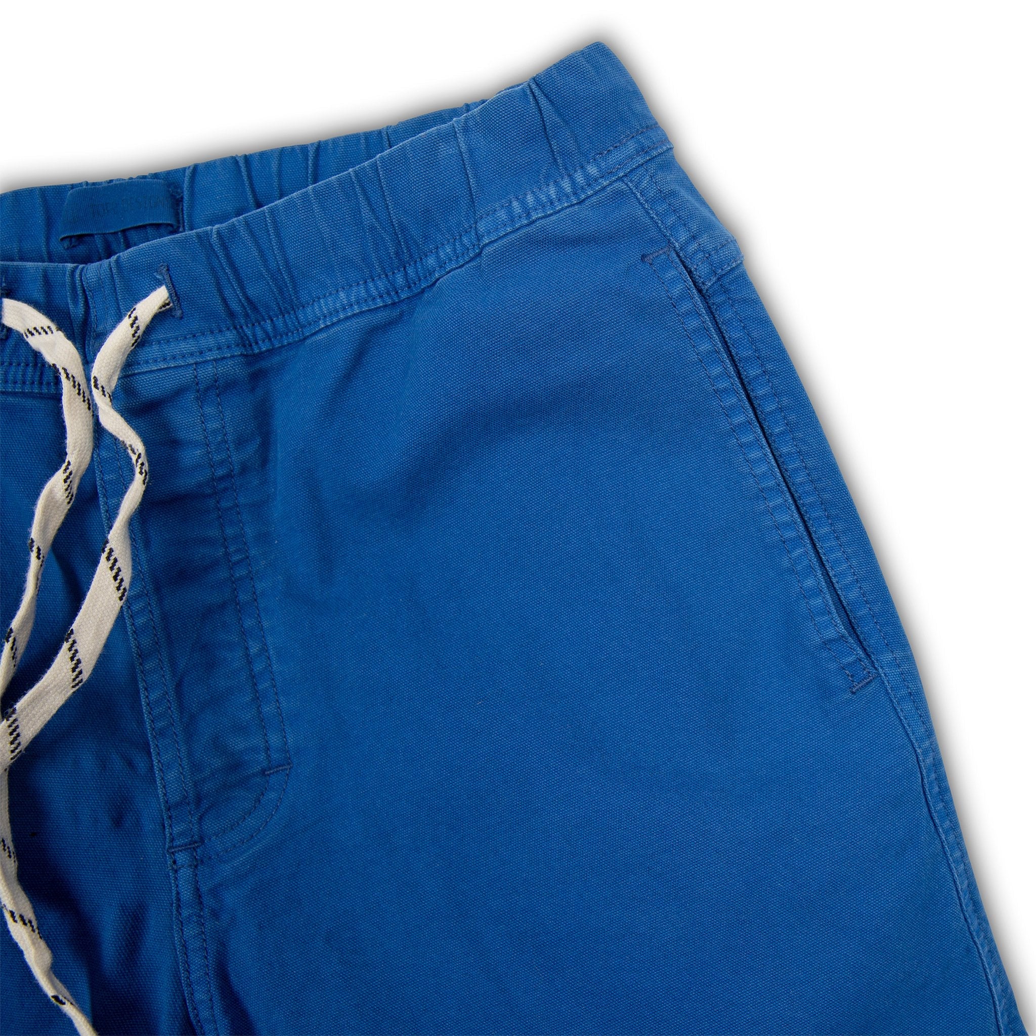 General shot of Topo Designs Men's drawstring Dirt Shorts in True Blue showing hand pockets.