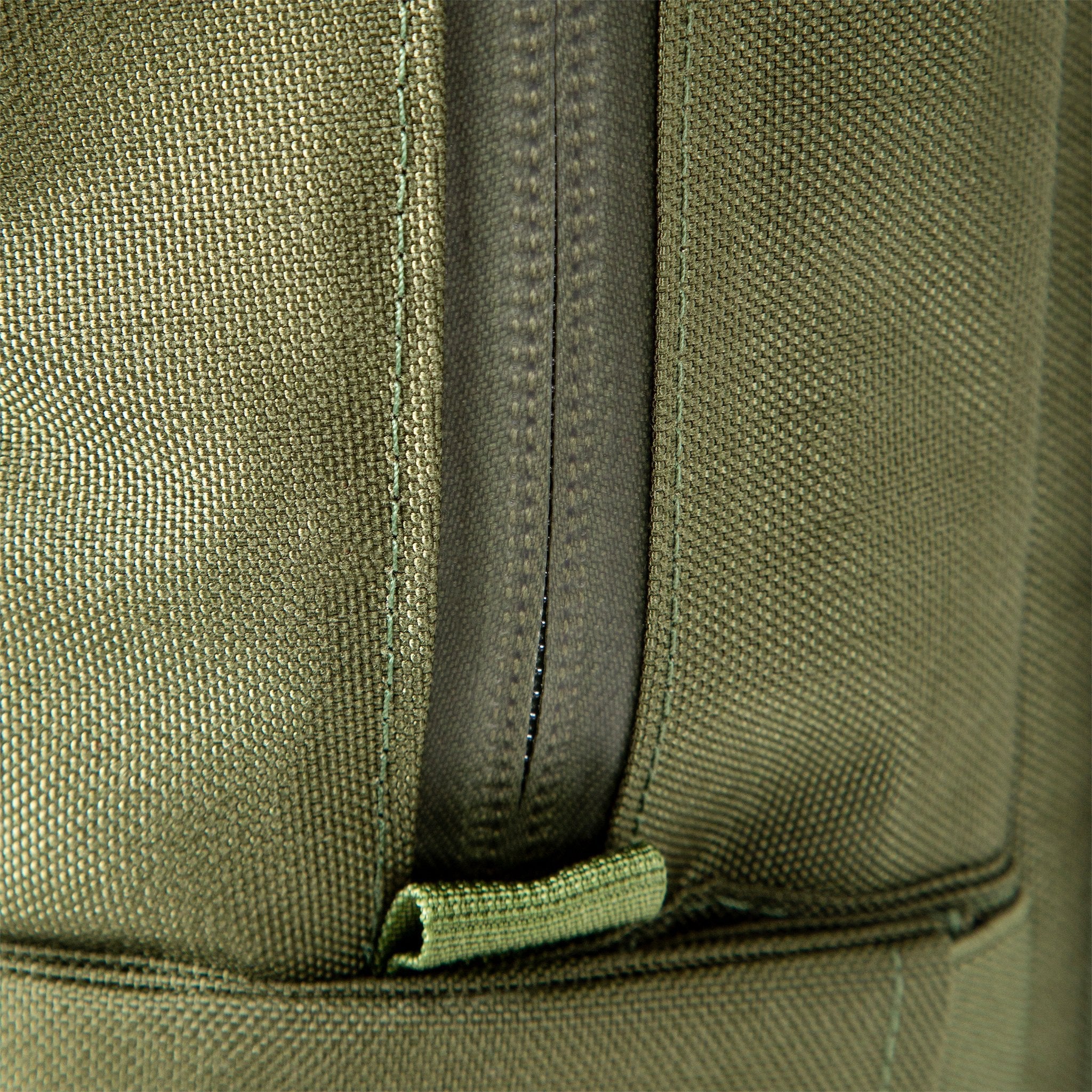 General shot of weather resistant zippers on Topo Designs Daypack Tech 100% recycled nylon backpack in "Olive" green.