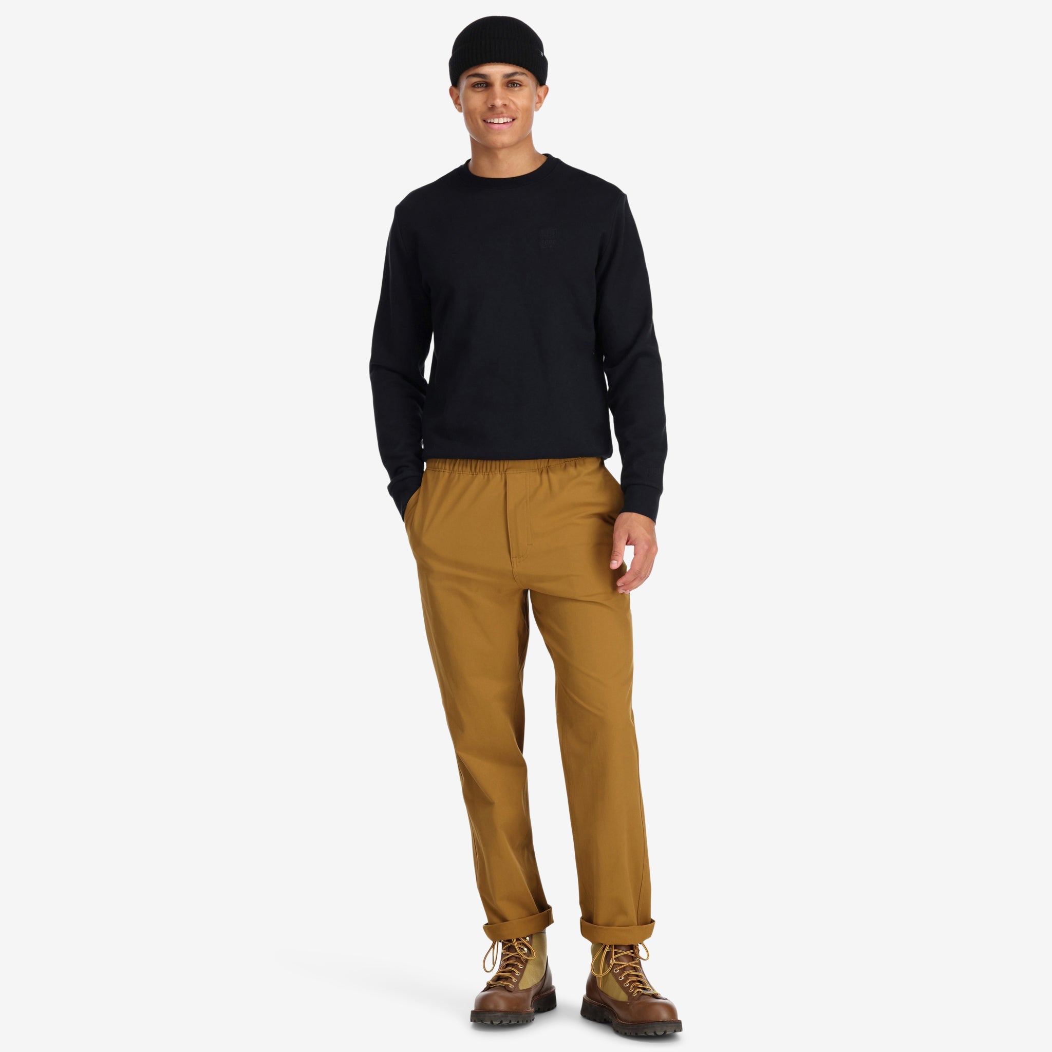 Front model shot of Topo Designs Men's Boulder lightweight climbing & hiking pants in "dark khaki" brown. Show on "Pond Blue" "Black" & "Charcoal"