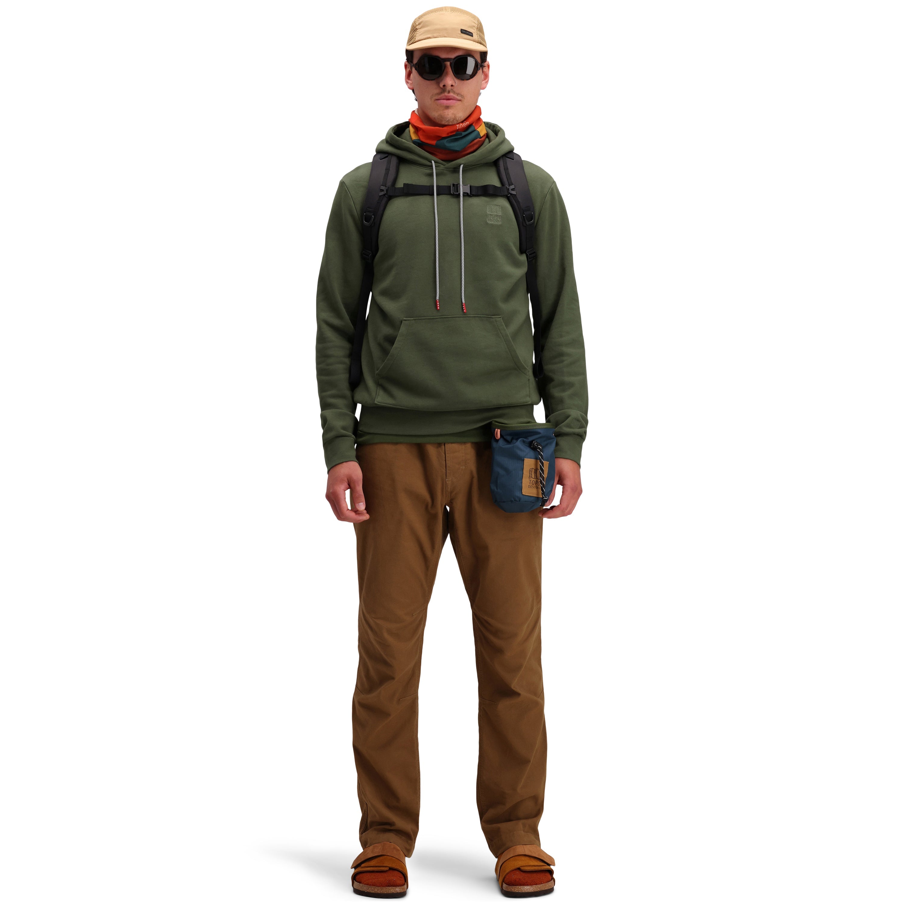 Front model shot of  Topo Designs Men's Dirt Pants 100% organic cotton drawstring waist in "Dark Khaki" brown.