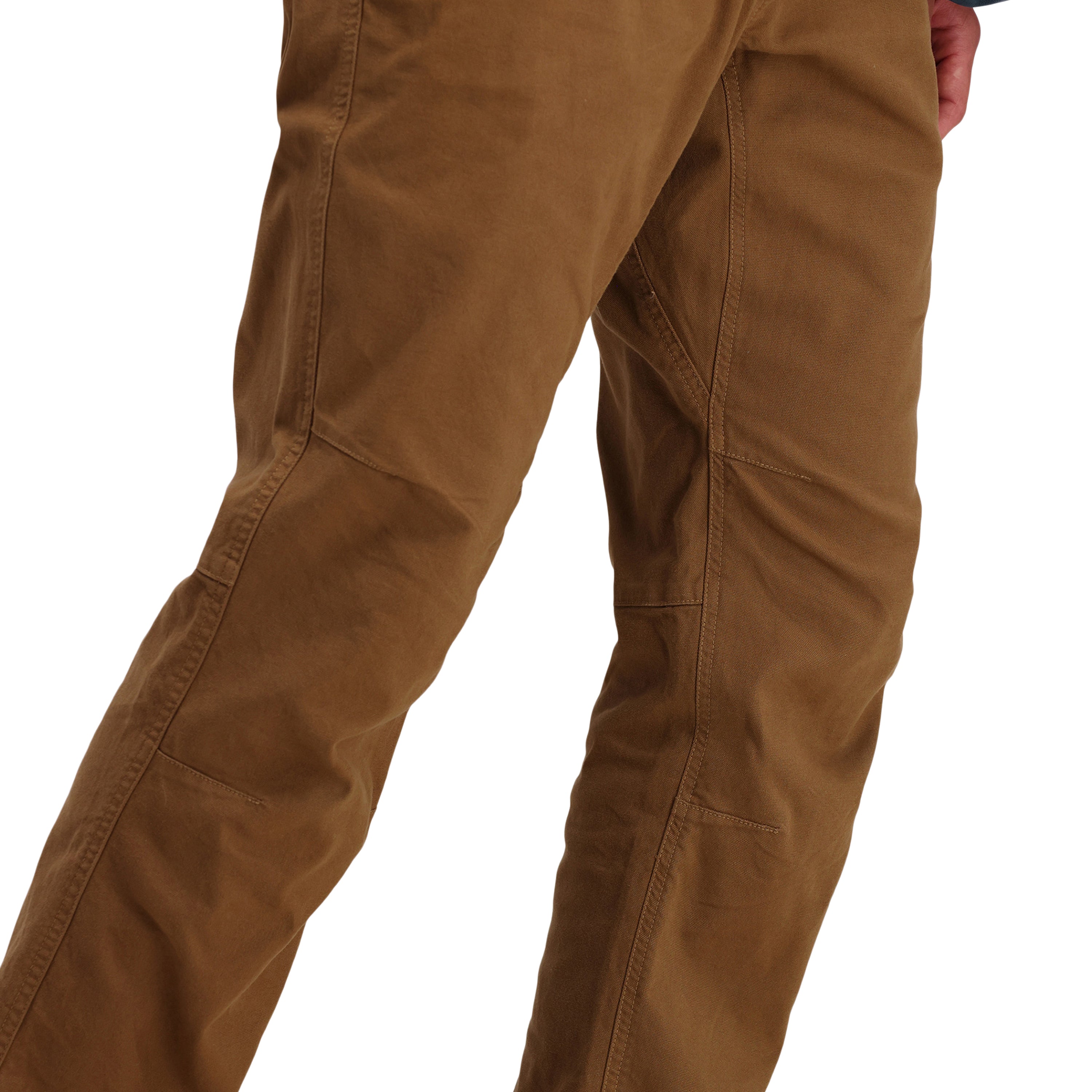 Front model shot of Topo Designs Men's Dirt Pants 100% organic cotton drawstring waist in "Dark Khaki" brown.