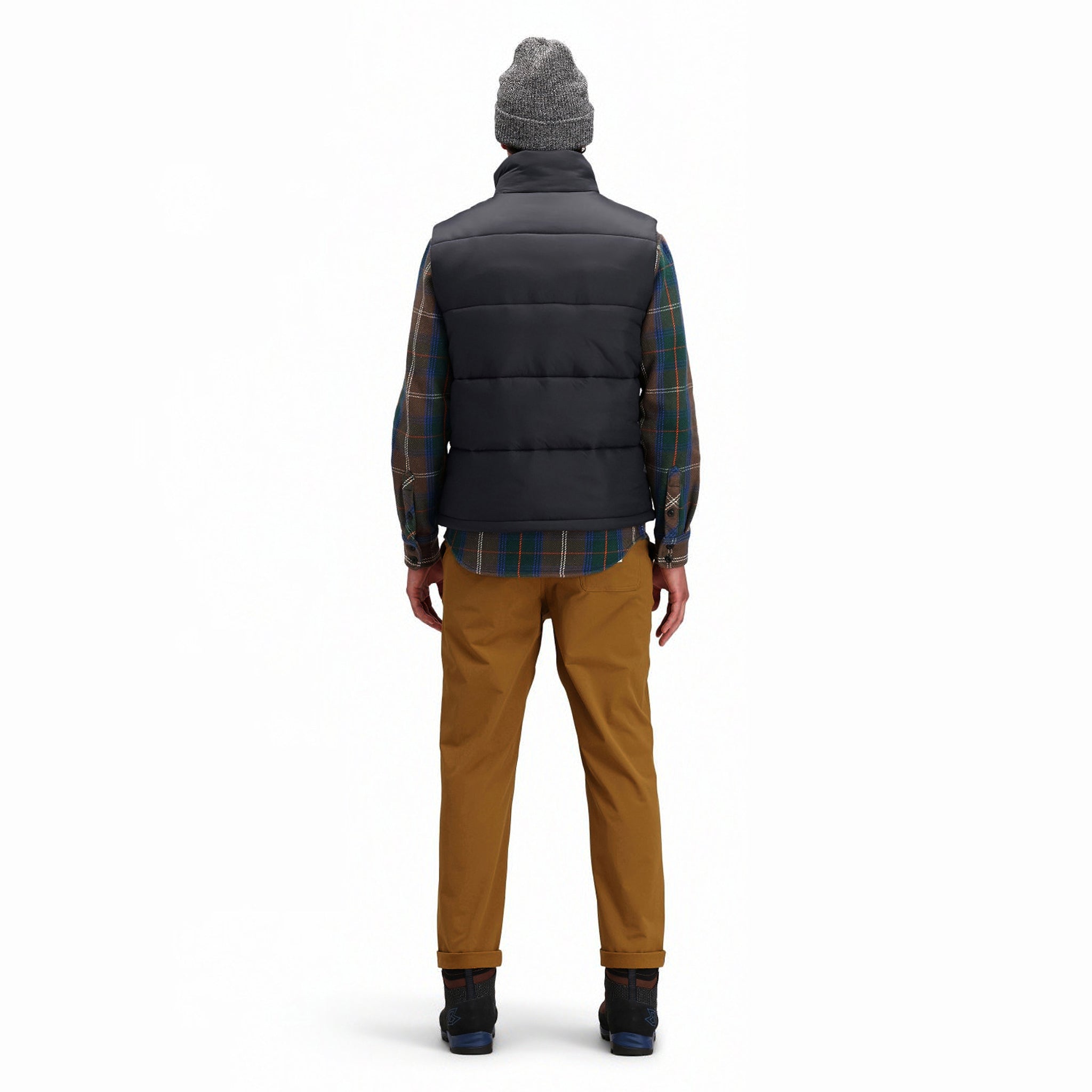 Back model shot of Topo Designs Men's Mountain Puffer recycled insulated Vest in "Black".