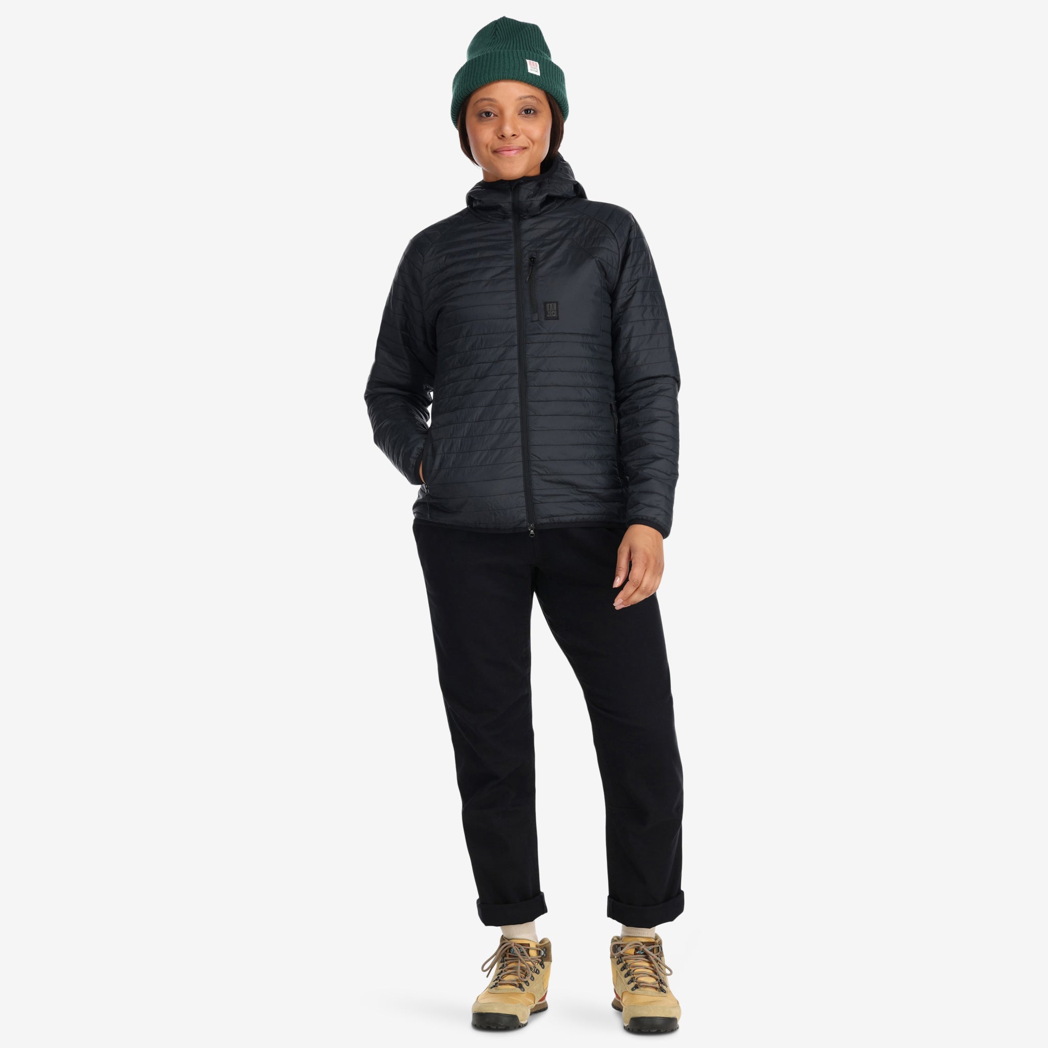 Front model shot of Topo Designs Women's Global Puffer recycled insulated packable Hoodie jacket in "black"