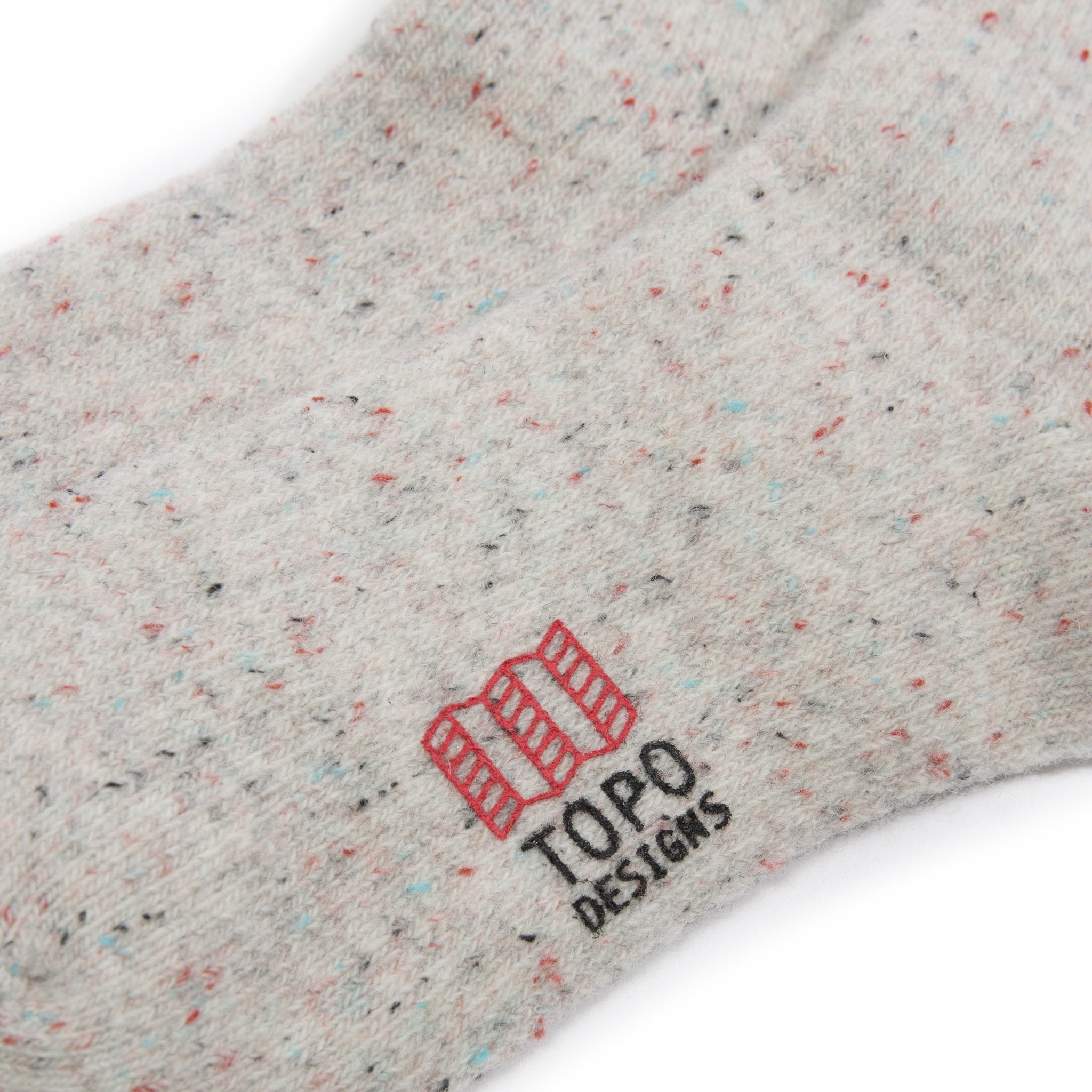 Detail shot of mountain socks in "natural" showing logo