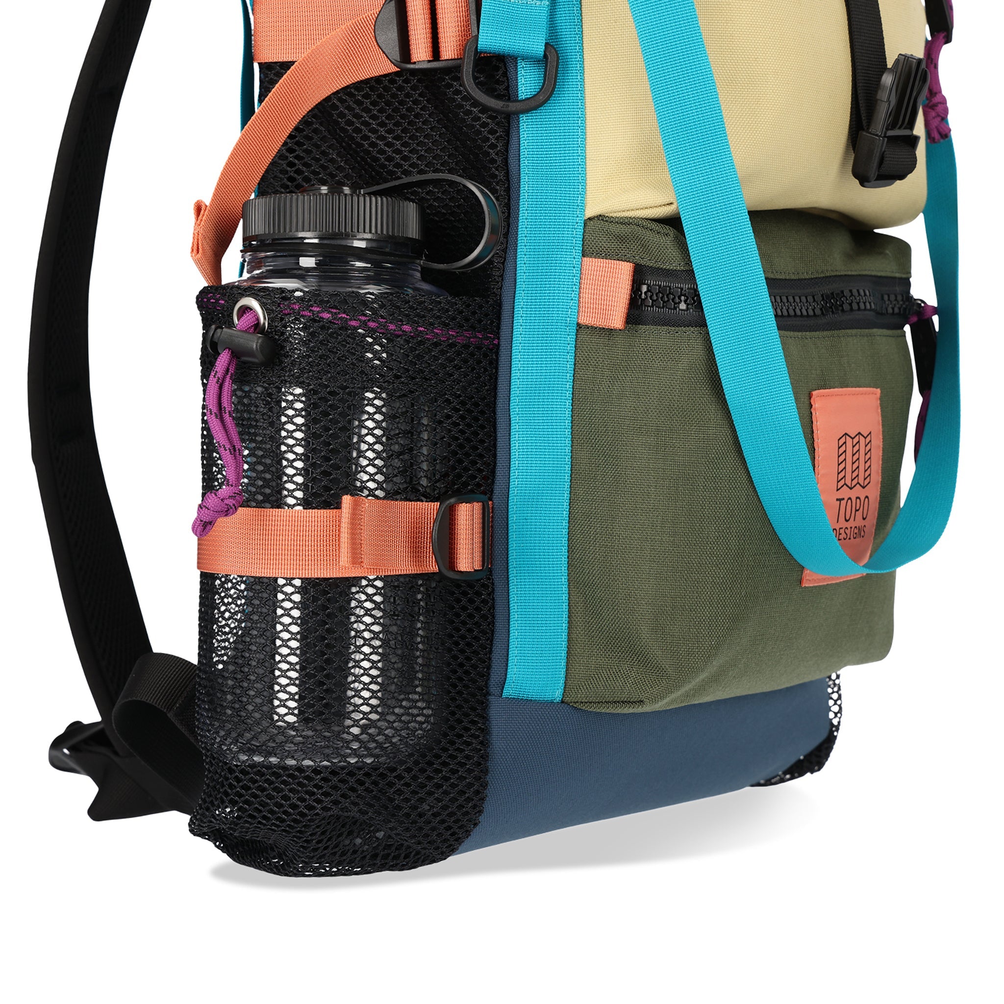 General shot of nalgene in expandable mesh side water bottle pockets on Topo Designs River Bag cinch top tote backpack with mesh sides in hemp brown olive green recycled nylon.