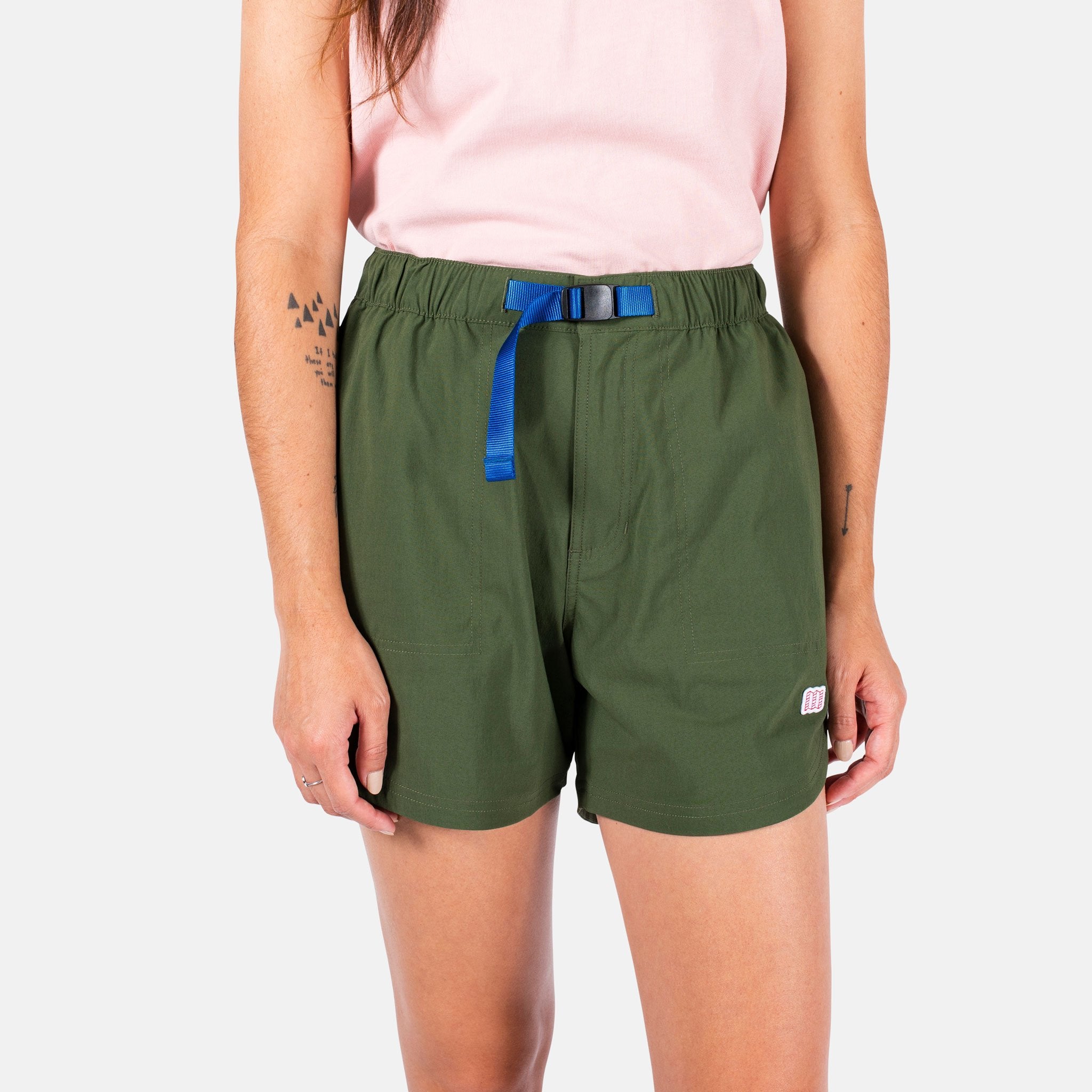 General close-up front model shot of Topo Designs Women's River Shorts in olive green.