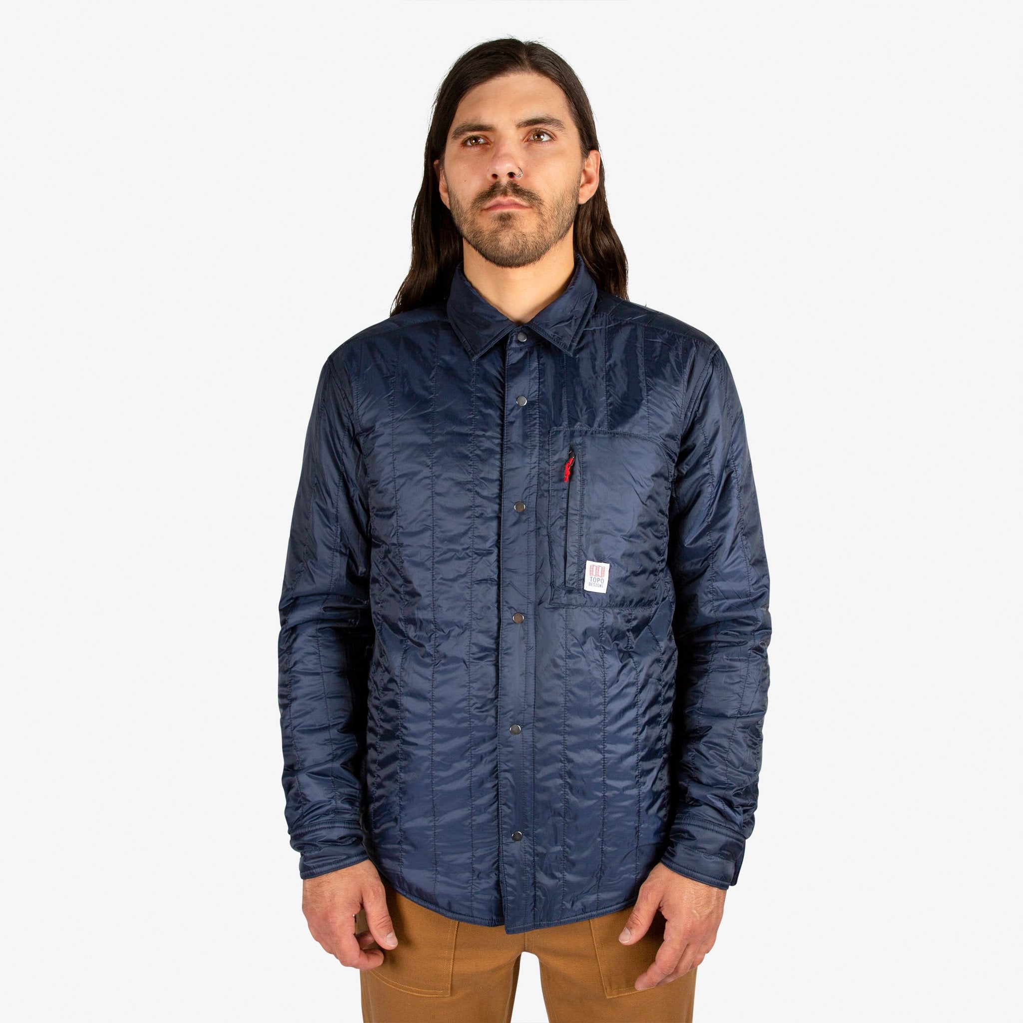 General close-up front model shot of Men's Topo Designs Insulated Shirt Jacket in Navy blue.