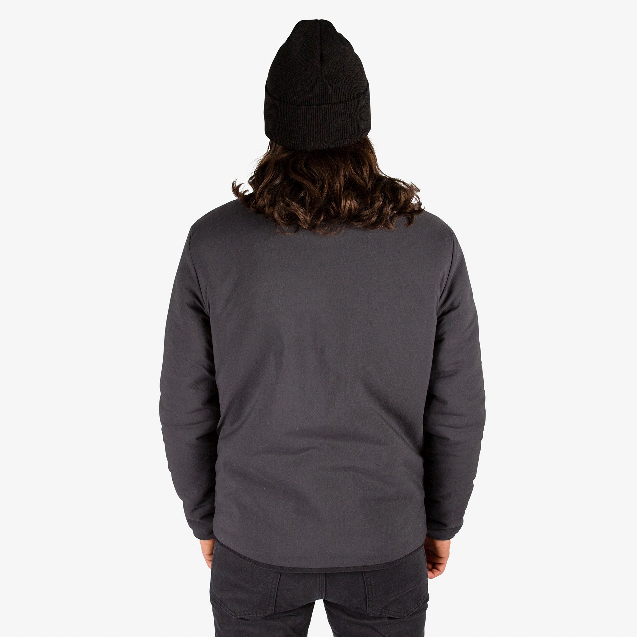 General close-up back model shot of Topo Designs Men's Sherpa Jacket in Black showing DWR side.